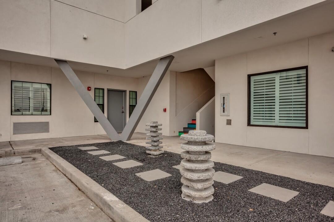 A courtyard with a gravel and stone design